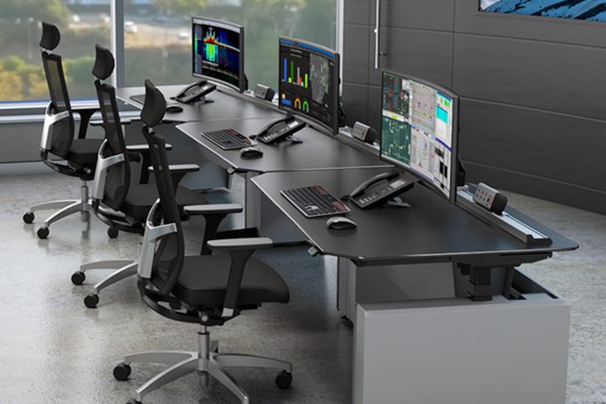 Horizon Consoles in action within the utilities industry with a view of three desk console positions